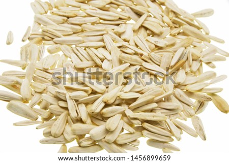 sunflower seeds and shells isolated on white background
