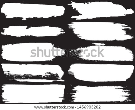 Collection of brush strokes grunge style. Abstract traces from the rollers. White stripes on a black background. Vector abstract elements
