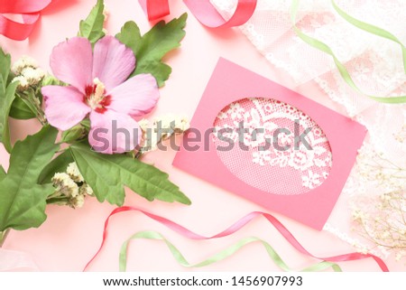 wedding card design. pink flowers, lace, wedding ring and envelope on a pink background. congratulation. wedding invitation