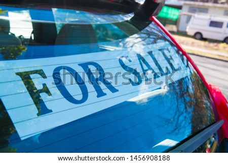 Car For Sale with advertisement sign on the back window. Automotive Industry.