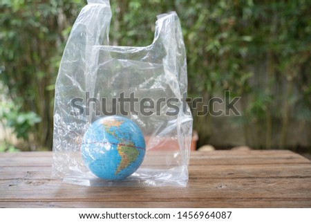 Globe in polyethylene plastic disposable bag.