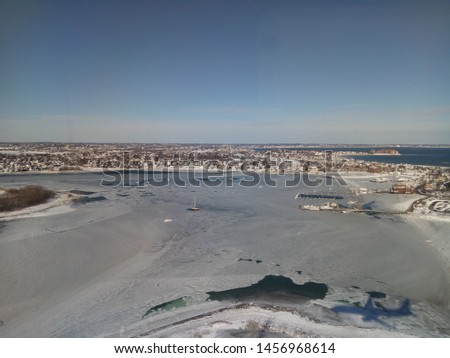 Aerial view of the downtown Boston and the frozen Massachusetts Bay in the winter