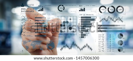 Intelligence (BI) and business analytics (BA) with key performance indicators (KPI) dashboard concept.business documents on office table with smart phone and digital tablet and graph on wide screen. Royalty-Free Stock Photo #1457006300