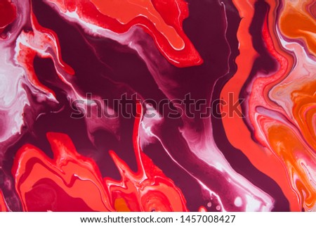 Liquid marbling paint background. Clorful mix of acrylic vibrant colors