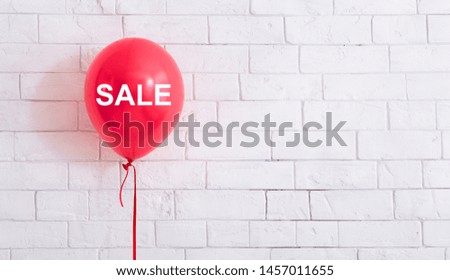 Big summer sale. Pink balloon with white text hang out in front of white bricks wall background, panorama, copy space
