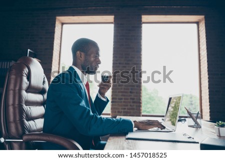Photo of dark skin guy texting notebook with partners hold hot beverage wear elegant costume sitting office chair