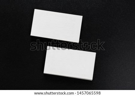 Mockup of business cards at dark background.