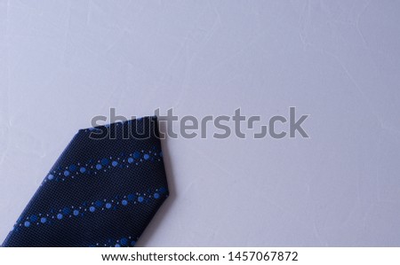 Blue tie isolated on white background.