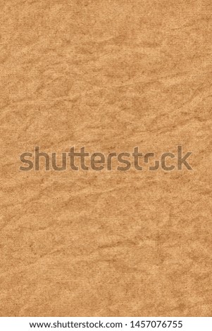 Photograph of recycle light brown Kraft striped paper coarse grain crumpled grunge texture sample