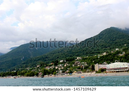 The beautiful city of Gagra, Abkhazia with its gorgeous mountains white beaches and clear blue water. Similar travel photos of panorama of the water area