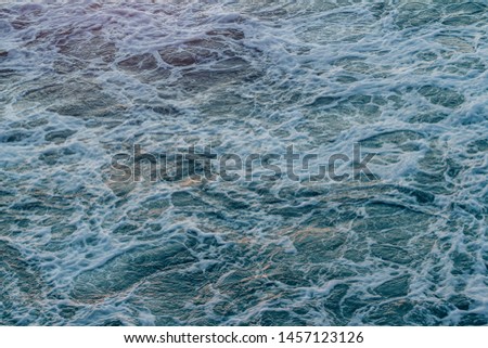 Background shot of aqua sea water surface
