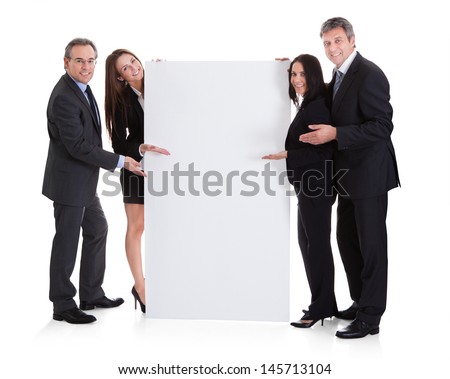 Happy Business People Showing Placard Over White Background