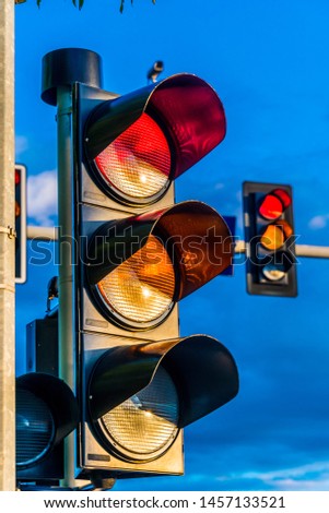 Traffic lights over urban intersection. Red light