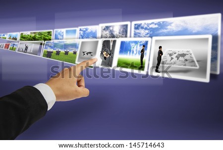 hand select image on digital technology screen