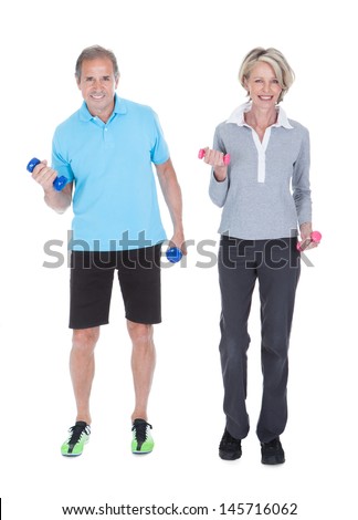 Happy Mature Couple Doing Exercising With Dumbbells Isolated On White Background
