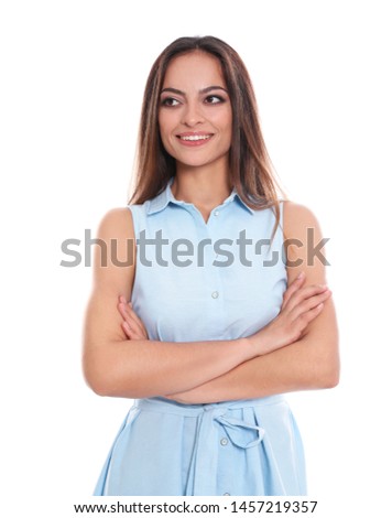Portrait of beautiful young woman in dress on white background