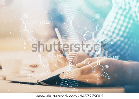 Man's hands working with notes background. Genetic engineering and gene manipulation concept.