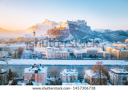 Classic view of the historic city of Salzburg with famous Hohensalzburg Fortress and Salzach river in scenic morning light at sunrise on a beautiful cold sunny day in winter, Salzburger Land, Austria Royalty-Free Stock Photo #1457306738