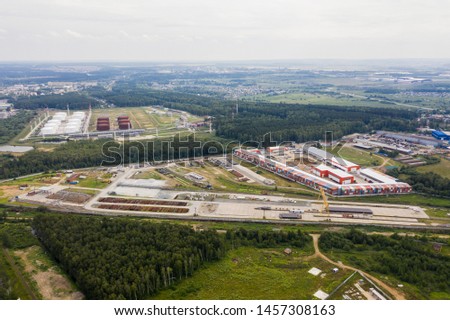 Aerial view of large warehouse. Logistics center in industrial city zone from above. Drone picture