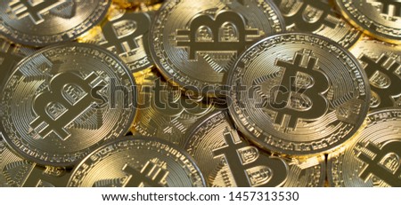 Golden Bitcoin coins pile. A new type of business finance concept