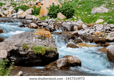 Beautiful peaceful view of water in mountain river. Slow shutter speed