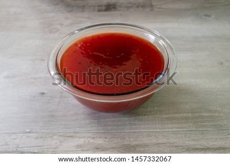 Sweet and sour sauce in bowl. Sweet and sour chicken ingredient. Dipping sauce.