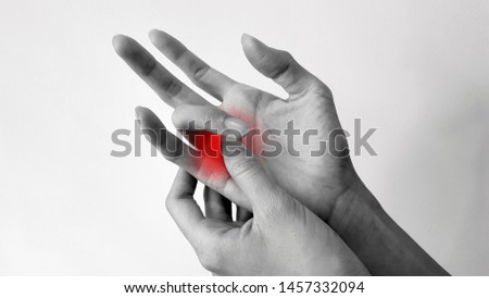 Trigger finger disease (locking finger or stenosing tenosynovitis disorder), hand anatomy with highlight on painful area.  Patient has pain and catching of finger problem. Medical symptom concept Royalty-Free Stock Photo #1457332094
