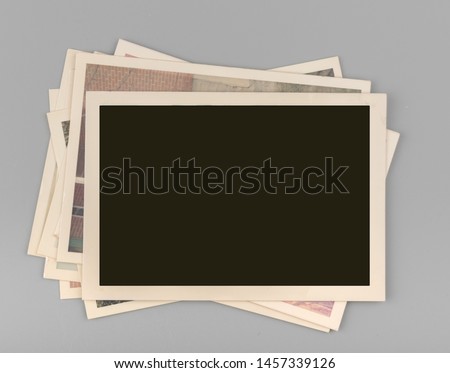Stack of Blank vintage photos Royalty-Free Stock Photo #1457339126