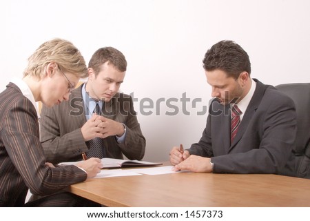 Business meeting - 2 men, 1 woman, - signing contract
