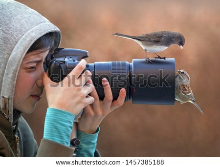 Funny picture with girl photographing birds