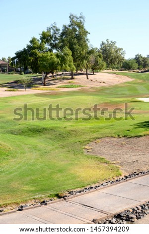 empty green golf field ready for golfers