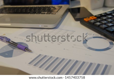 Business Analytics with a Laptop and pen.