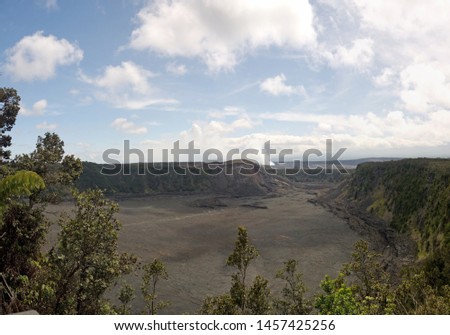 Kilauea Hawaiian volcano Iki Crater view with rising smoke and steam on the horizon