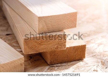 Wooden beam on the table in sunlight.
