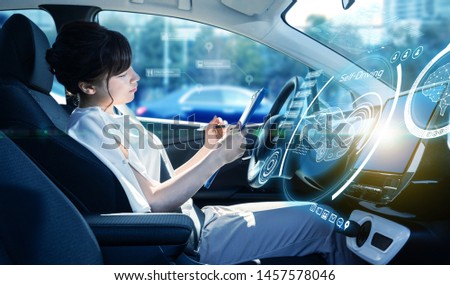 Interior of autonomous car. Driverless vehicle. Self driving. UGV. Royalty-Free Stock Photo #1457578046