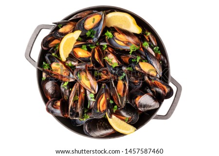 Marinara mussels, isolated with a clipping path on a white background. Moules mariniere cooked in a pan, top shot Royalty-Free Stock Photo #1457587460