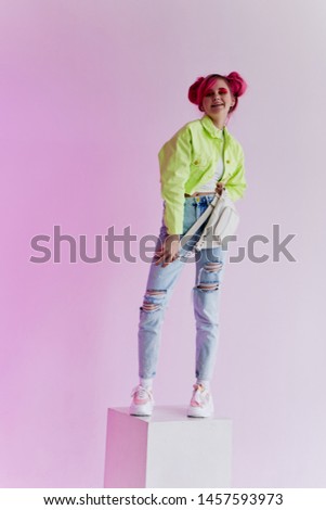 woman in jeans standing on neon cubic retro fashion