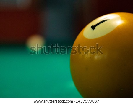 
snooker ball number 1 lying on the table