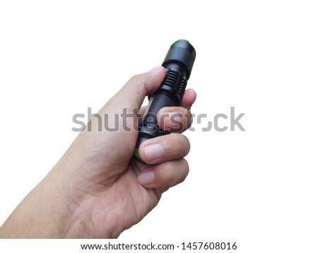 Hand holding Portable Flashlight isolated on a white background.