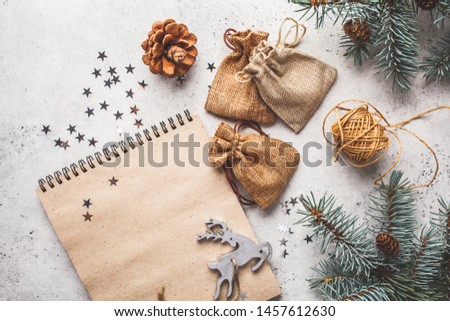 Christmas background with Christmas tree and notepad. Christmas flat lay.