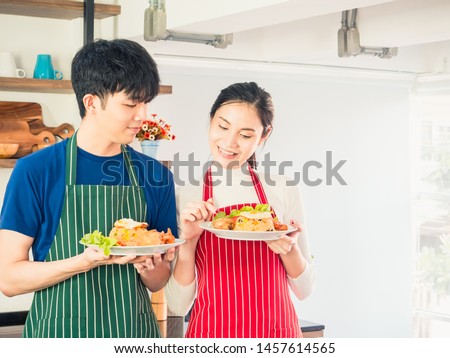 Asian couple young man and girl are preparing foods for eat.