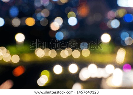 Jakarta city skyline with blurred lights at night. Jakarta, Indonesia