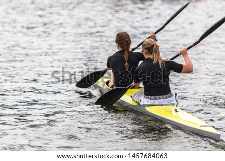 Women's professional kayaking themed photo.