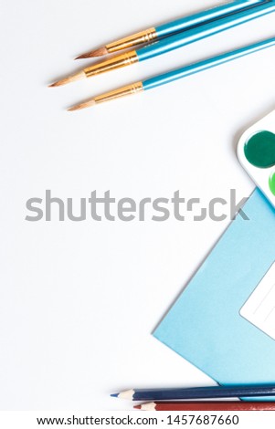 The colorful office and school supplies. Copy space for text or inscription. White background. 