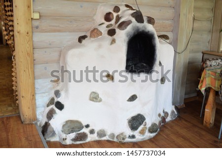 stone OVEN of white colour in a wooden house
