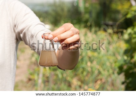 researcher testing the water quality Royalty-Free Stock Photo #145774877