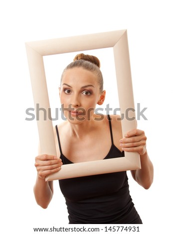 Beautiful woman holding a frame and smiling. Isolated on white
