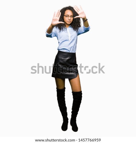 Young beautiful business girl with curly hair wearing glasses Smiling doing frame using hands palms and fingers, camera perspective