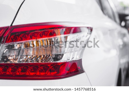 Modern rear light on new white automobile