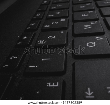 black and white keyboard keys with numbers and letters
